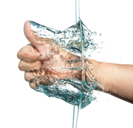 Fist through the waterの写真素材
