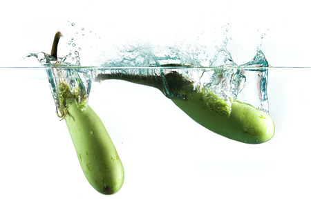 aubergine in water splashの写真素材