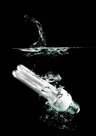 light bulb drops into waterの写真素材