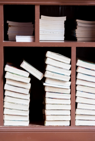 Books on a wooden shelfs.の写真素材