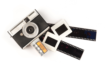 old camera and blank film strip on White backgroundの写真素材