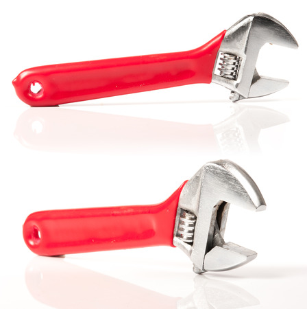 Red and Silver Metal Monkey Wrench Isolated On White Background.の写真素材