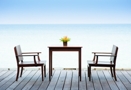 Terrace sea view with outdoor wood chairs and tableの写真素材