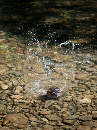 Background of rock and splashing water dropの写真素材