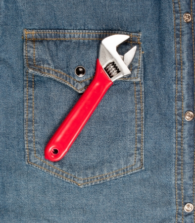 closeup of an adjustable wrench on jeanの写真素材