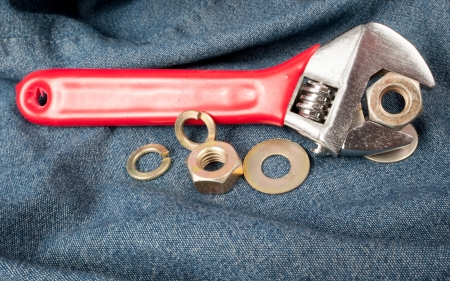 closeup of an adjustable wrench on jeanの写真素材