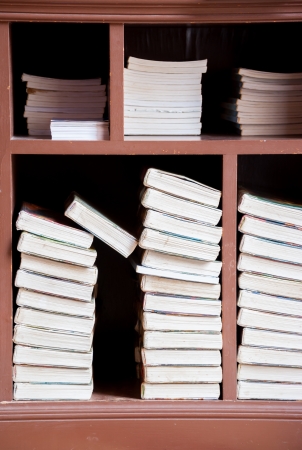 Books on a wooden shelfs.の写真素材