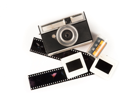 old camera and blank film strip on White backgroundの写真素材