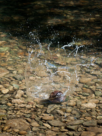 Background of rock and splashing water dropの写真素材