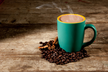 cup of hot coffee on wood backgroundの写真素材