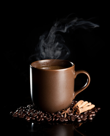 aromatic cup of coffee with smoke and beansの写真素材