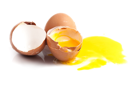 Broken egg isolated on white backgroundの写真素材