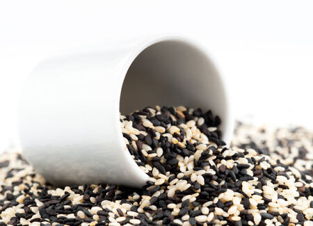 black and white sesame seeds isolated の写真素材