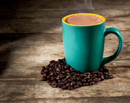 cup of hot coffee on wood backgroundの写真素材