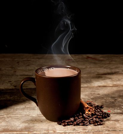 brown cup and wooden space in darkの写真素材