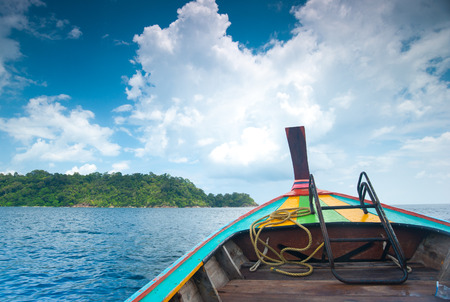 Traditional wooden boat with Lipe island in Thailandの写真素材