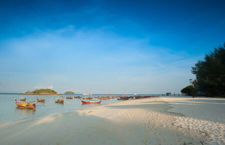 Seascape with a fisherman's boat in Thailandの写真素材