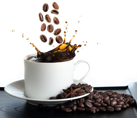 splash coffee isolated on white backgroundの写真素材