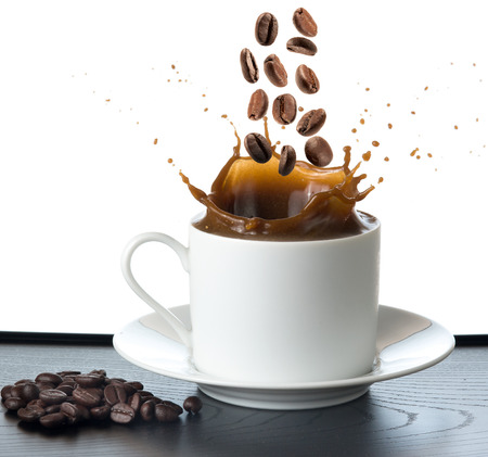 splash coffee isolated on white backgroundの写真素材