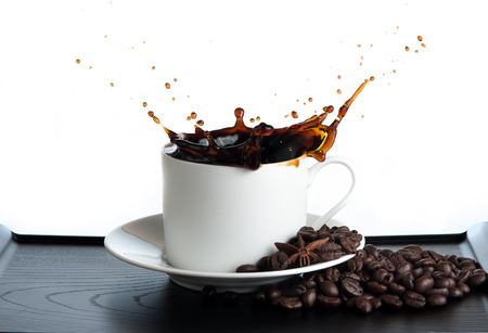 splash coffee isolated on white backgroundの写真素材