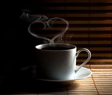 Coffee cup  on old wooden backgroundの写真素材
