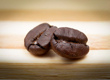 Coffee Beans on rural wooden backgroundの写真素材