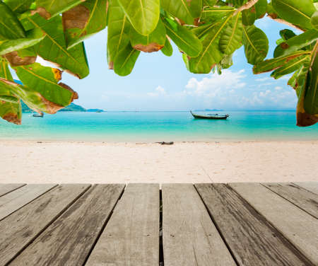 Traditional wooden long tail boats on a picture perfect tropical beach near Phuket, Thailand, Asia.の写真素材