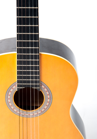 Wooden acoustic guitar isolated closeup horizontalの写真素材
