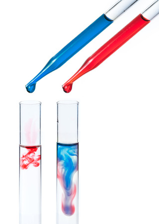 liquid dripping from pipette into test tube isolatedの写真素材