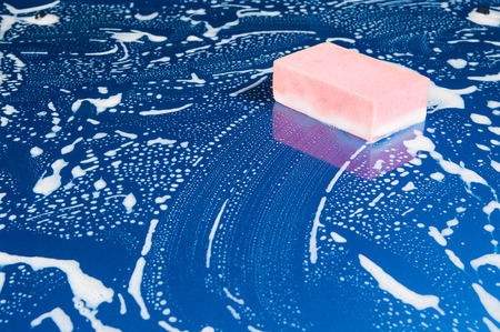 sponge over the car for washingの写真素材