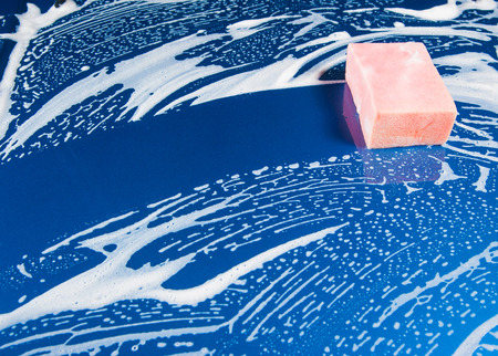 sponge over the car for washingの写真素材