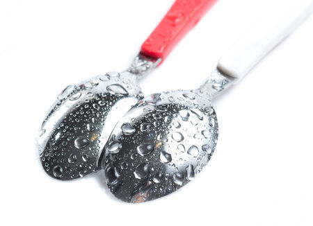 Spoons with water dropsの写真素材