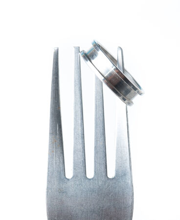 wedding rings and forkの写真素材