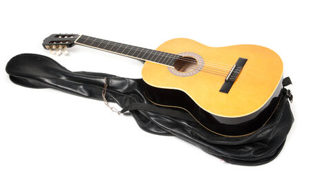 The image of acoustic guitar in a caseの写真素材