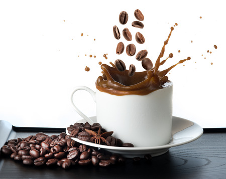 splash coffee isolated on white backgroundの写真素材