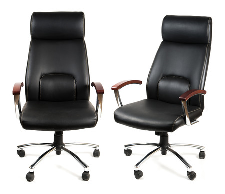 Black leather office chair isolated on whitの写真素材