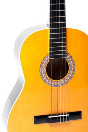 Wooden acoustic guitar isolated closeup horizontalの写真素材