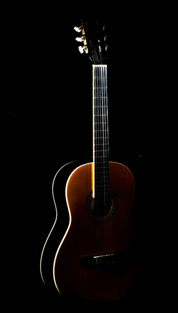 Detail of an acoustic guitar with a shallowの写真素材