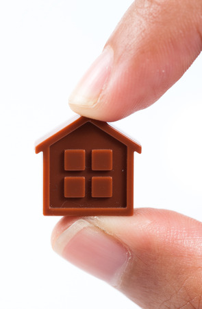 Hand holding houseの写真素材