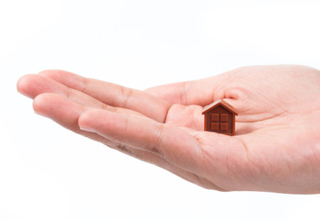 Hand holding houseの写真素材