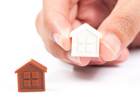 House Wooden in hand - isolated on white backgroundの写真素材