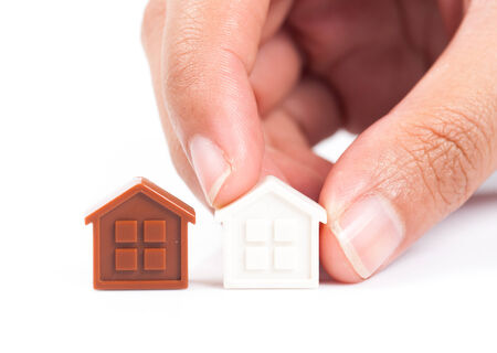 House Wooden in hand - isolated on white backgroundの写真素材