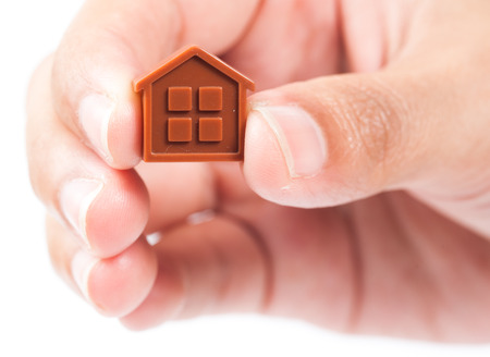 House Wooden in hand - isolated on white backgroundの写真素材