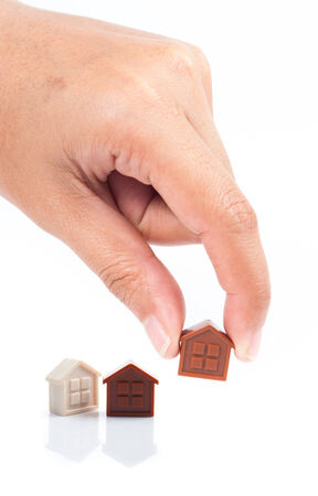 House Wooden in hand - isolated on white backgroundの写真素材
