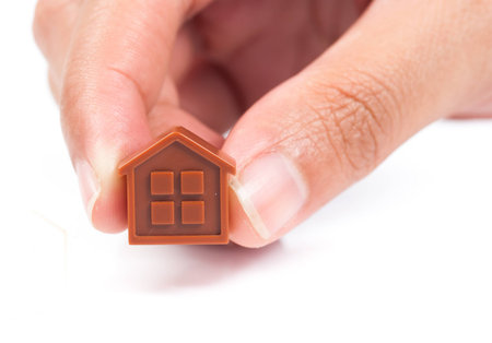 House Wooden in hand - isolated on white backgroundの写真素材