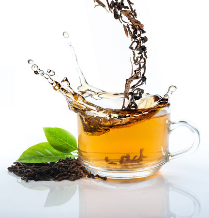 Tea flowing in cupの写真素材