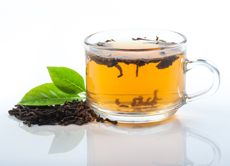 Glass Cup Tea with green leaves, Isolated on White Backgroundの写真素材