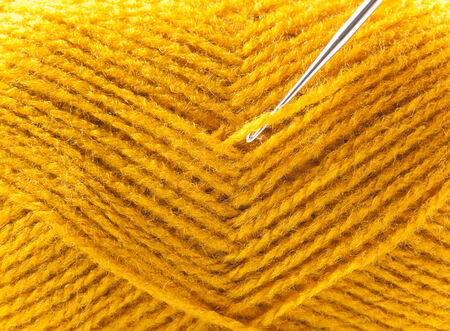 yellow yarn as a backgroundの写真素材