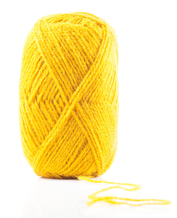 Yellow wool yarn isolated on white backgroundの写真素材