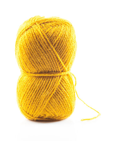 Yellow wool yarn isolated on white backgroundの写真素材